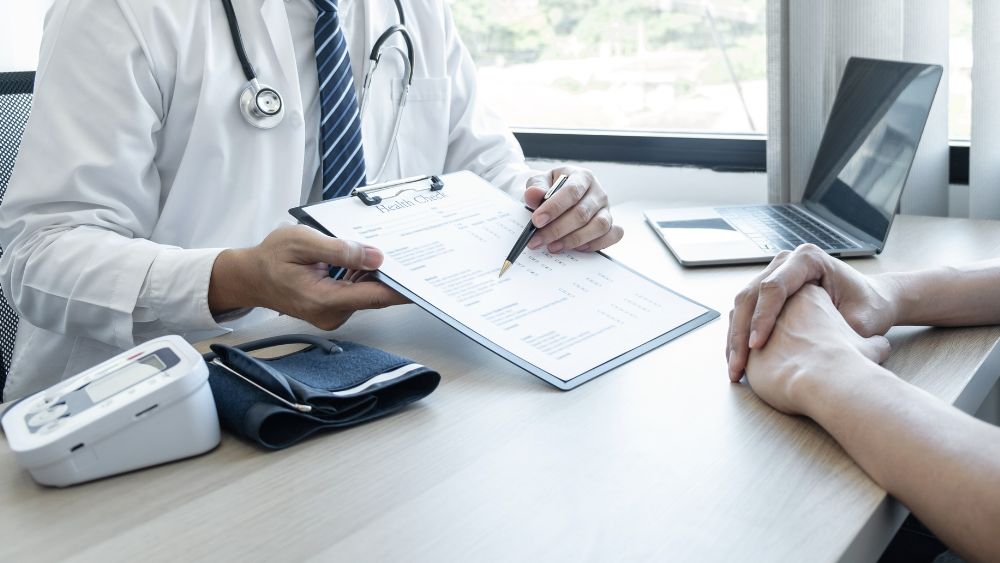 Doctor consulting patient in clinic